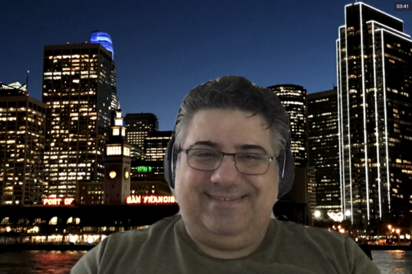Arash Hooshyari with cityscape virtual background
