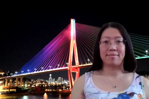 Cathy Lu with virtual background of bridge