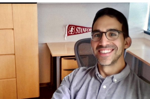 David Mejias with virtual background of Stanford office