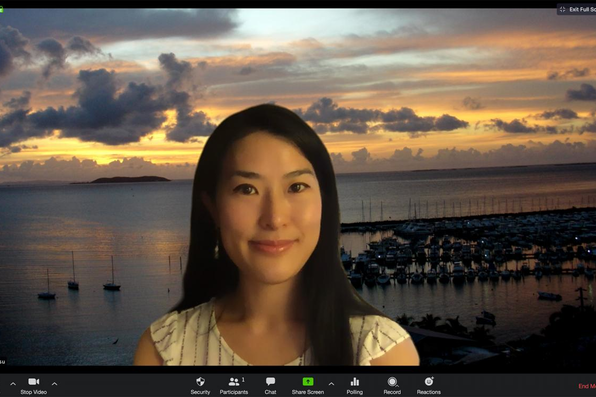 Hana Hsu with virtual background of Puerto Rico sunset