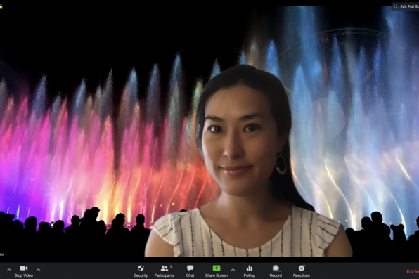 Hana Hsu with virtual background of Disneyland