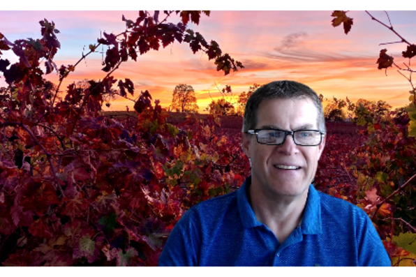 Jeff McMahon with virtual background of red leaf trees