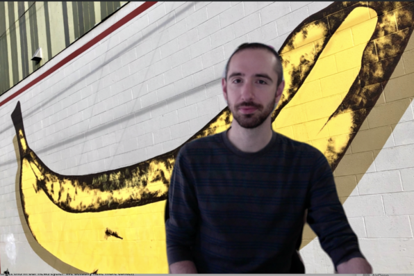 Jim Fabry with virtual background of a banana mural