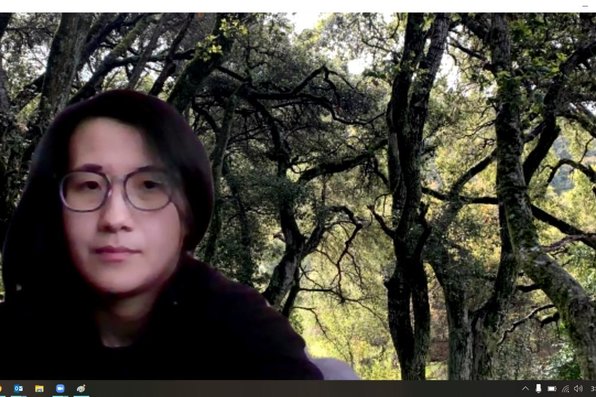 Joanie Ly with virtual background of trees