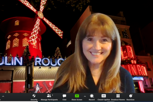 Laurie Spears with virtual background of Moulin Rouge