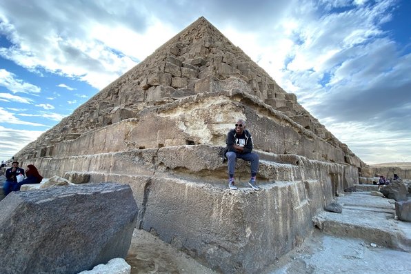 Man sitting on pyramid in Egypt