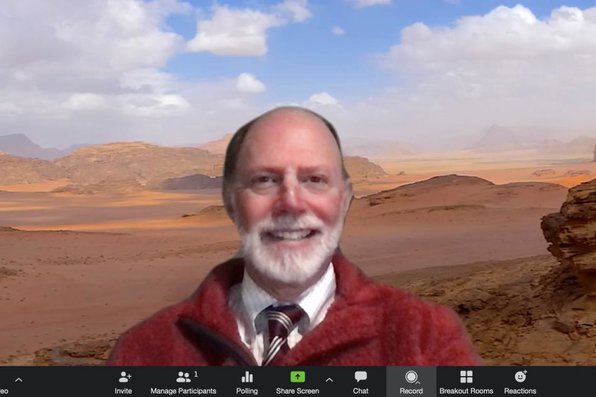 Paul Blumenthal with a virtual background of the Jordanian desert