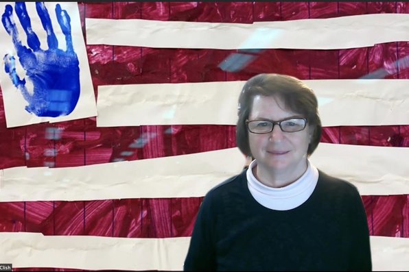 Robin McClish with a virtual background of her grandson's American flag painting