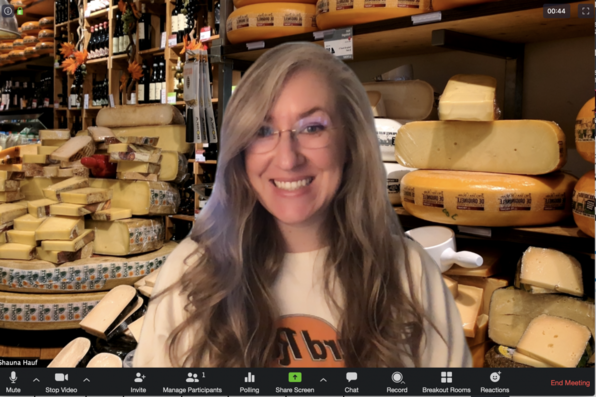 Shauna Hauf with a virtual background of a cheese shop