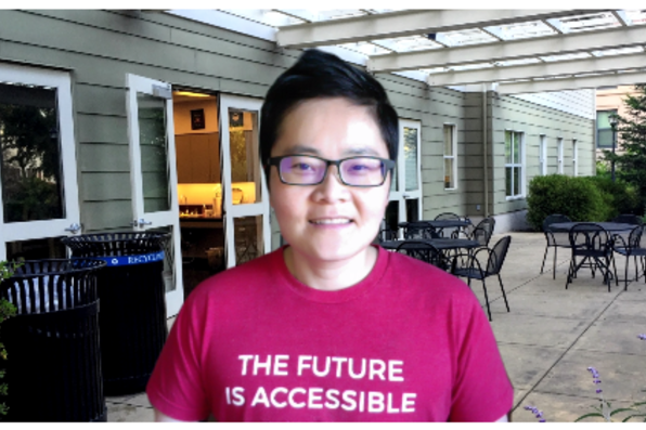 Shelley Hou with a virtual background of student services building